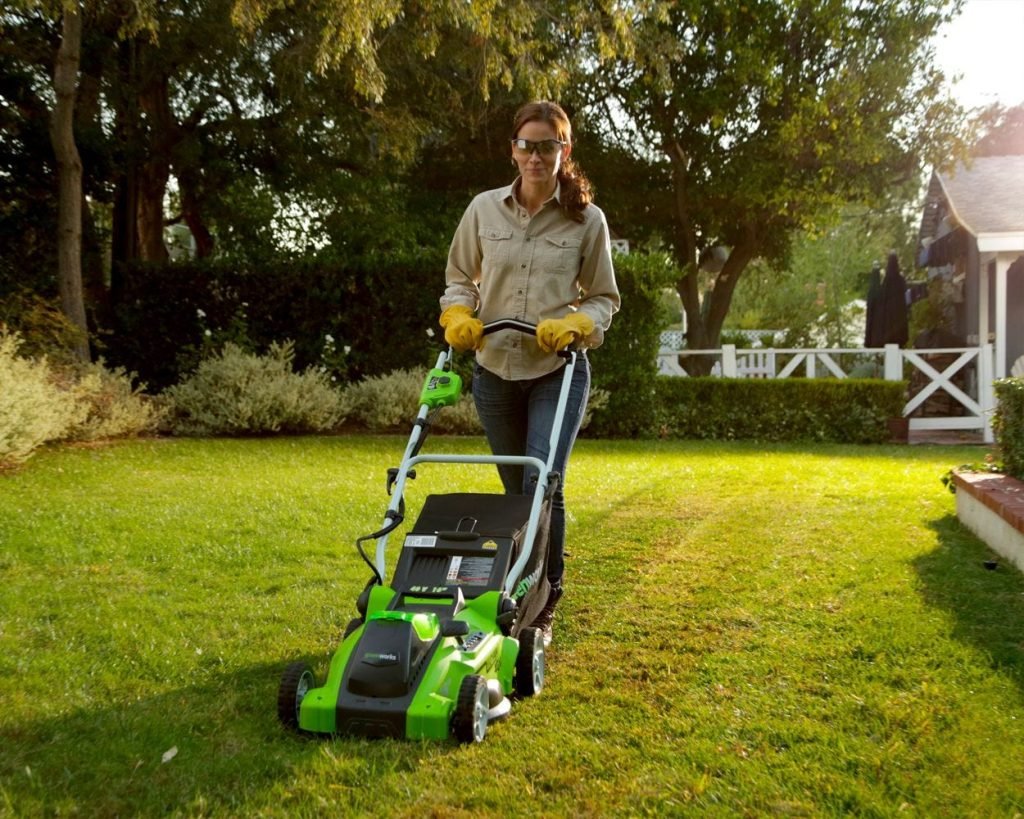 woman mowing small yard