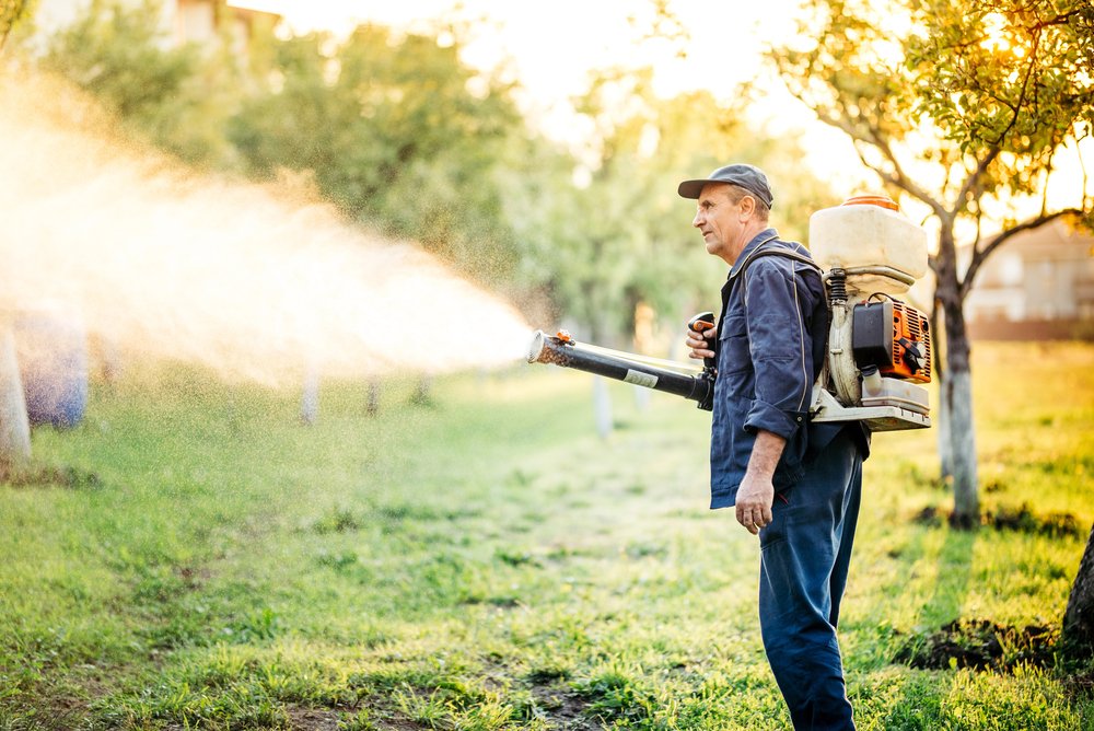 using sprayer to repel mosquitos in yard