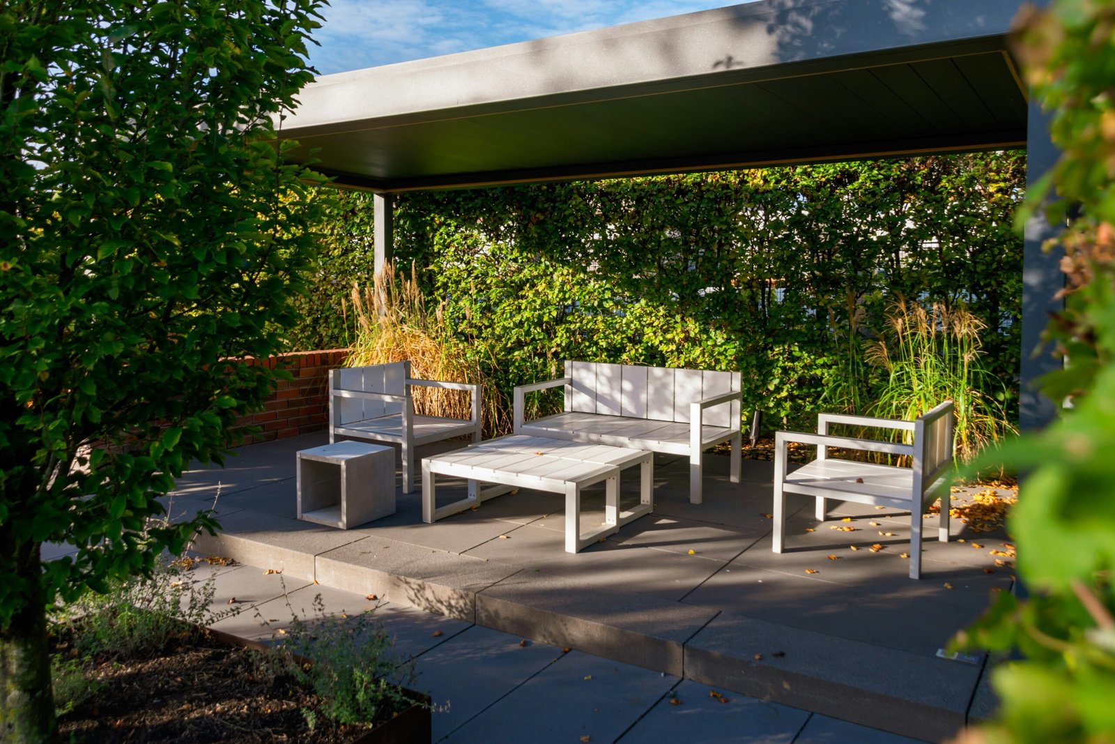 A finished outdoor patio and seating area representing a completed landscape design plan