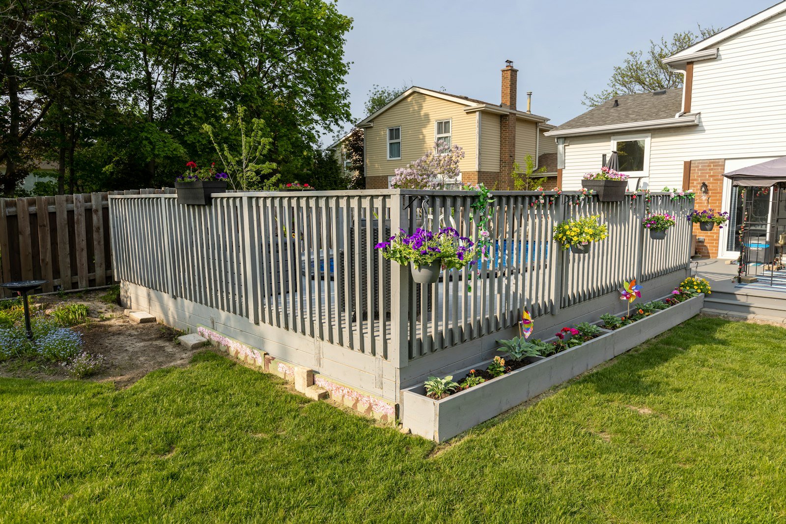 Custom backyard deck and fence design, an example of a premium landscape design package
